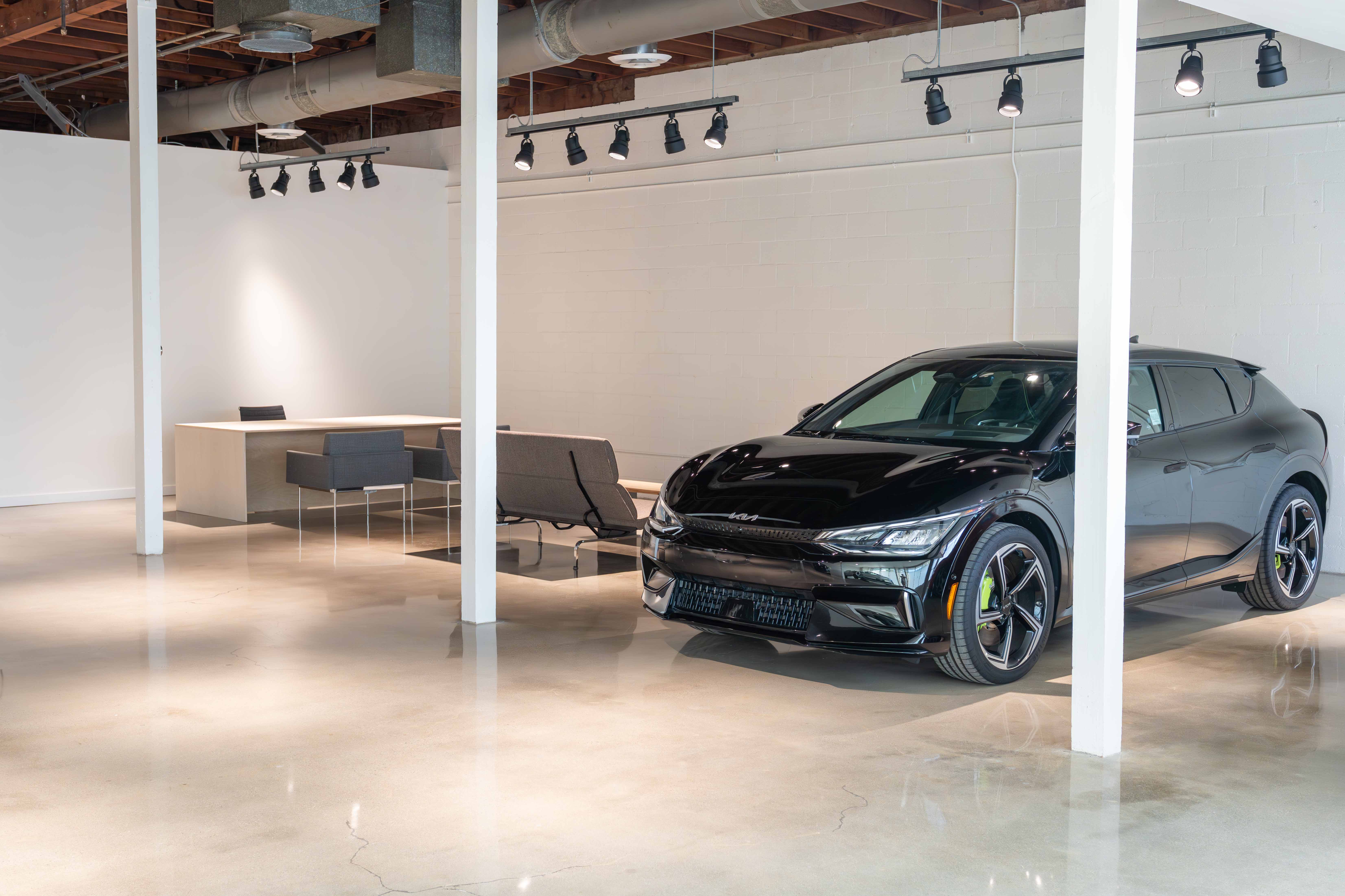 Modern showroom interior with electric vehicle